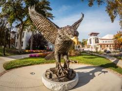 red hawk statue on a sunny day